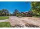 Charming two-story home with a welcoming exterior and a spacious driveway surrounded by mature trees at 3607 Twin Rivers Trl, Parrish, FL 34219