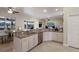 Well-lit kitchen with granite counters, stainless appliances, and bar stool seating at 3607 Twin Rivers Trl, Parrish, FL 34219