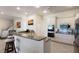 Modern kitchen with granite counters, stainless steel appliances, and bar stool seating at 3607 Twin Rivers Trl, Parrish, FL 34219
