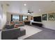 Cozy living room with a large sectional sofa, a flat-screen TV, and a popcorn machine for movie nights at 3607 Twin Rivers Trl, Parrish, FL 34219