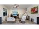 Relaxing living room with stylish decor, ceiling fan, and access to the staircase at 3607 Twin Rivers Trl, Parrish, FL 34219