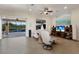Comfortable living room with ceiling fan, recessed lighting, and open access to outdoor pool area at 3607 Twin Rivers Trl, Parrish, FL 34219