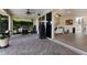 Spacious covered patio with outdoor kitchen, lounge area, and seamless indoor-outdoor living at 3607 Twin Rivers Trl, Parrish, FL 34219