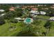 Aerial view of neighborhood showing the pool at 3890 Wilshire Cir # 27, Sarasota, FL 34238