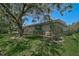 Backyard view of home showing the well-manicured lawn and garden at 3890 Wilshire Cir # 27, Sarasota, FL 34238