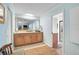 Comfortable bathroom featuring a large vanity, tile floors and walls, and blue walls at 3890 Wilshire Cir # 27, Sarasota, FL 34238