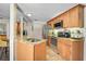 Updated kitchen featuring granite countertops, stainless appliances, and abundant natural light, with a breakfast bar at 3890 Wilshire Cir # 27, Sarasota, FL 34238