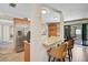 Bright kitchen with granite countertops, stainless appliances, a breakfast bar and access to outdoor living at 3890 Wilshire Cir # 27, Sarasota, FL 34238