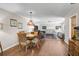 Cozy living area featuring hardwood floors, a stained glass light fixture, and comfortable seating at 3890 Wilshire Cir # 27, Sarasota, FL 34238