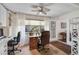 Bright home office with built-in shelving, neutral paint, and large window providing lots of natural light at 3890 Wilshire Cir # 27, Sarasota, FL 34238