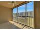 Tiled balcony with views of the community pool and surrounding greenery providing a serene outdoor space at 3950 Ironwood Cir # 206, Bradenton, FL 34209
