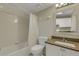 Bright bathroom with tile shower, granite countertop, and modern fixtures at 3950 Ironwood Cir # 206, Bradenton, FL 34209