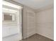 Walk-in closet with shelving and access to the ensuite bathroom with vanity at 3950 Ironwood Cir # 206, Bradenton, FL 34209