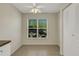 Dining area featuring natural light from the window and tiled floors at 3950 Ironwood Cir # 206, Bradenton, FL 34209