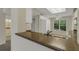 Kitchen with double sink, granite countertops and view of backyard landscaping at 3950 Ironwood Cir # 206, Bradenton, FL 34209