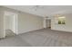 Open-concept living area with views to the kitchen and access to additional rooms, creating an inviting flow at 3950 Ironwood Cir # 206, Bradenton, FL 34209