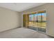 Comfortable living room has sliding glass doors to a balcony, letting in ample light and fresh air at 3950 Ironwood Cir # 206, Bradenton, FL 34209
