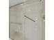 Shower with grab bar, clear glass doors, and tiled walls at 3950 Ironwood Cir # 206, Bradenton, FL 34209