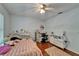 Bedroom with hardwood floors and a ceiling fan at 4033 Dover E Dr, Bradenton, FL 34203