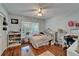 Bedroom with hardwood floors, a closet, and a window at 4033 Dover E Dr, Bradenton, FL 34203