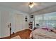 Bedroom with hardwood floors, a ceiling fan, and a closet at 4033 Dover E Dr, Bradenton, FL 34203