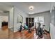 Home gym with modern fitness equipment, hardwood floors, and arched entry to another room at 4033 Dover E Dr, Bradenton, FL 34203