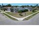 Well-maintained corner lot home with lush landscaping and mature palm trees at 4033 Dover E Dr, Bradenton, FL 34203