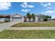 Charming single-story home boasts a well-maintained lawn and a two-car garage, enhancing its curb appeal at 4033 Dover E Dr, Bradenton, FL 34203