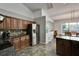 Kitchen view with stainless steel appliances, tile backsplash, and granite countertops at 4033 Dover E Dr, Bradenton, FL 34203