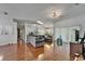 Open living area with hardwood floors, gray sofa, skylight, and lots of space at 4033 Dover E Dr, Bradenton, FL 34203