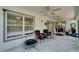 Enclosed patio featuring ceiling fans and comfortable seating, perfect for relaxation at 4033 Dover E Dr, Bradenton, FL 34203