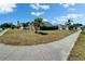 Corner lot featuring landscaping, sidewalks, and greenery at 4033 Dover E Dr, Bradenton, FL 34203