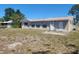 Simple backyard with a plain, functional design, offering potential for customization and outdoor activities at 4058 Gatewood Dr, Sarasota, FL 34232