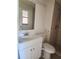Well-lit bathroom featuring a stand up shower, updated vanity and new toilet at 4058 Gatewood Dr, Sarasota, FL 34232
