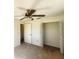 Bedroom featuring carpet floors and a standard-sized closet at 4058 Gatewood Dr, Sarasota, FL 34232