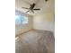 Bedroom featuring carpet floors, a ceiling fan and a sizable closet at 4058 Gatewood Dr, Sarasota, FL 34232