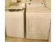 Functional laundry area featuring a full-size washing machine and dryer for convenient laundry care at 4058 Gatewood Dr, Sarasota, FL 34232