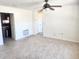 Spacious living area with tiled flooring, ceiling fan, and open layout, perfect for entertaining at 4058 Gatewood Dr, Sarasota, FL 34232