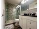 Stylish bathroom with a glass-enclosed shower, a dark vanity top, and gray accents at 4923 25Th W St # 104, Bradenton, FL 34207