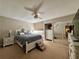 Comfortable bedroom featuring a large closet, ceiling fan, and carpeted floors at 4923 25Th W St # 104, Bradenton, FL 34207