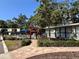 Community amenities featuring a pool and well-maintained landscaping at 4923 25Th W St # 104, Bradenton, FL 34207