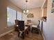 Bright dining area boasts wood-look floors, a chandelier and window at 4923 25Th W St # 104, Bradenton, FL 34207