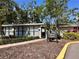 Exterior view of the fitness center featuring a welcoming path and well-maintained landscaping at 4923 25Th W St # 104, Bradenton, FL 34207