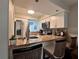 Charming kitchen with granite countertops, stainless appliances, and bar seating at 4923 25Th W St # 104, Bradenton, FL 34207