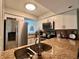Updated kitchen with stainless steel appliances, granite countertops, and ample counter space at 4923 25Th W St # 104, Bradenton, FL 34207