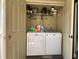 Convenient laundry closet with washer, dryer, shelving and extra storage at 4923 25Th W St # 104, Bradenton, FL 34207