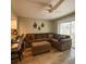 Comfortable living room with ceiling fan, slider to outdoor area, breakfast bar and coastal decor at 4923 25Th W St # 104, Bradenton, FL 34207