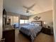 Inviting bedroom with ceiling fan, mirrored closet, and ensuite bathroom at 4923 25Th W St # 104, Bradenton, FL 34207