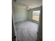 Cozy bedroom with a ceiling fan and a window offering views of the outdoors at 5082 Rilke Ln, Port Charlotte, FL 33981