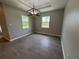 Bright dining area with stylish light fixture and large windows overlooking the yard at 5082 Rilke Ln, Port Charlotte, FL 33981